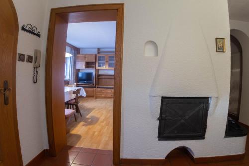 a view of a living room with a fireplace at App. Tamanhof in San Giorgio