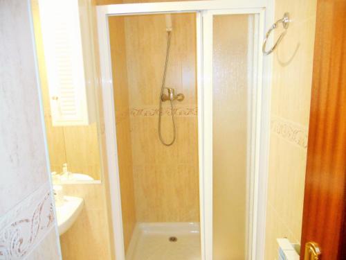 a bathroom with a shower and a sink at Martin House & Granada in Granada