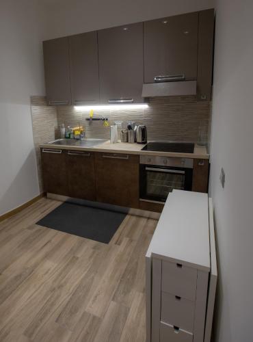 Una cocina o zona de cocina en TaoMau - Duomo Square
