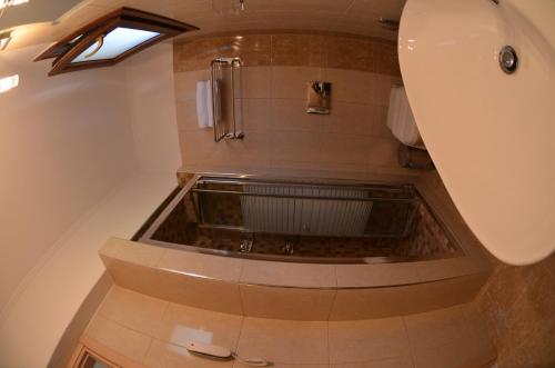 a bathroom with a shower and a sink at Glikadi Hotel in Limenas