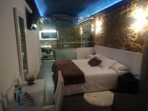 Ένα ή περισσότερα κρεβάτια σε δωμάτιο στο Casa O Gures