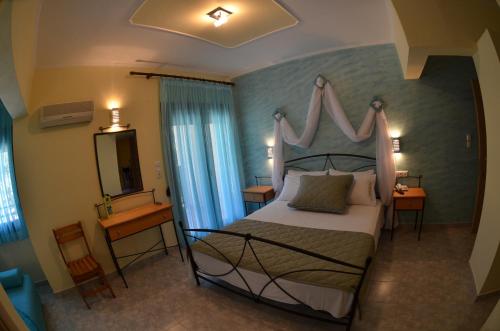 En eller flere senger på et rom på Glikadi Hotel