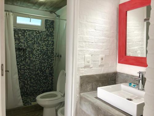 a bathroom with a white sink and a toilet at Las Olas Aparts in La Paloma
