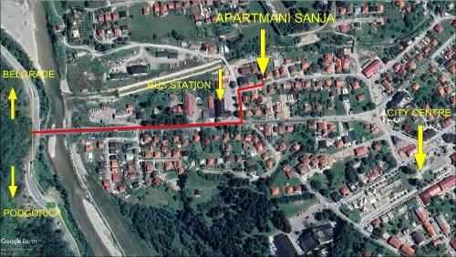 a map of a parking lot with yellow arrows at Rooms Sanja in Kolašin