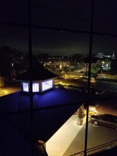 a view of a lit up building at night at Norwalk Inn & Conference Center in Norwalk