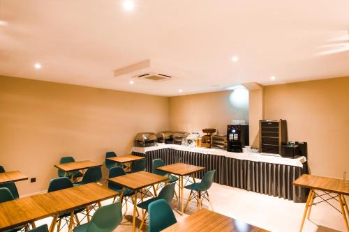 an empty restaurant with tables and chairs at Rossio Boutique Hotel in Lisbon