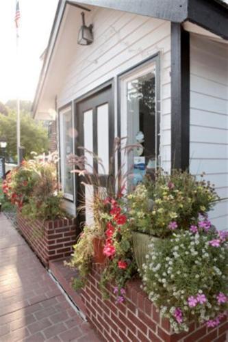 a house with flowers on the side of it at Afton House Inn in Afton