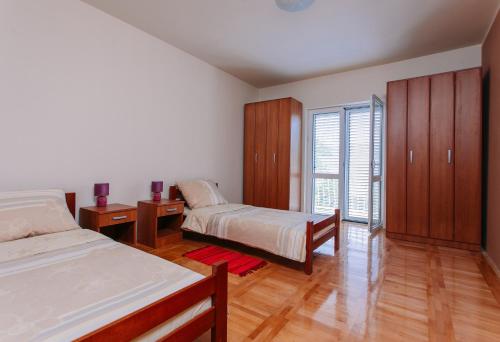 Ένα ή περισσότερα κρεβάτια σε δωμάτιο στο Villa Sladovic