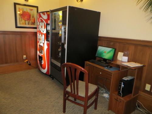 a room with a desk and a chair and a refrigerator at Hotel North Beach in San Francisco