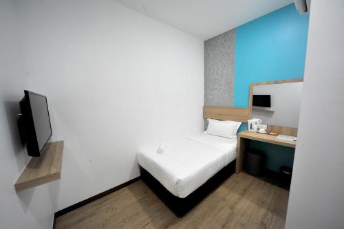 Ένα ή περισσότερα κρεβάτια σε δωμάτιο στο MYe Hotel