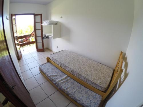 Säng eller sängar i ett rum på Residencial Sol de Ibiraquera