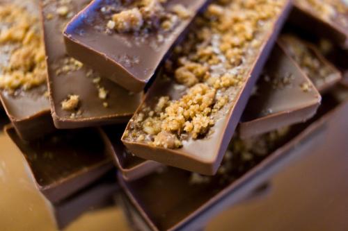 a group of chocolate bars with nuts on top at Style Hotel Grifone in Madonna di Campiglio