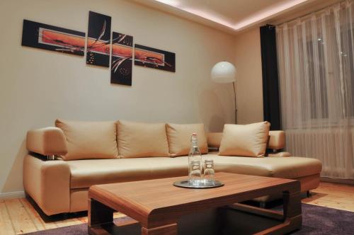 a living room with a couch and a coffee table at Best City Home Near Checkpoint Charlie in Berlin