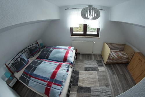 Postel nebo postele na pokoji v ubytování Ferienhaus Familie Lorenz