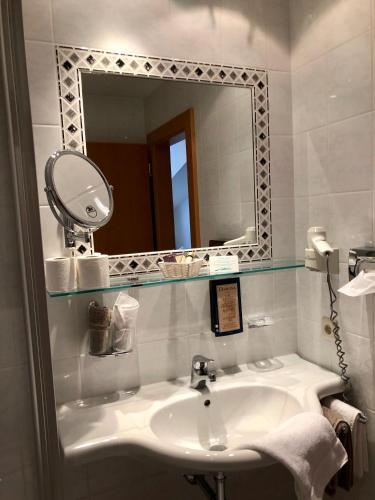 Koupelna v ubytování Arlen Lodge Hotel-Garni