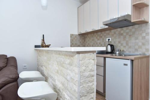 Kuchyň nebo kuchyňský kout v ubytování Apartments Royal