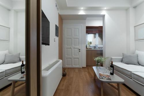 Ένα ή περισσότερα κρεβάτια σε δωμάτιο στο Porto Vecchio Luxury Suites