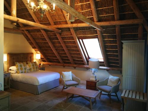 Postel nebo postele na pokoji v ubytování Gemoedsrus Farm