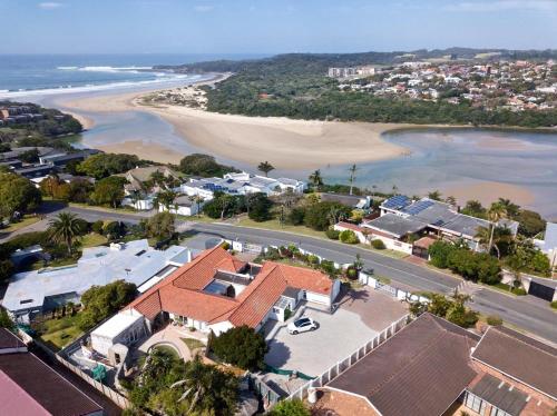 an aerial view of a house and the beach at Reef View BnB in East London
