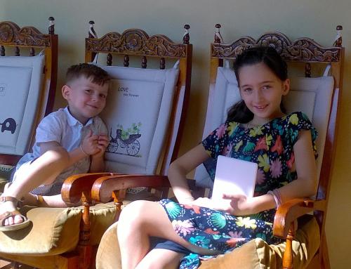 a boy and a girl sitting in chairs at Evergreen in Kandy