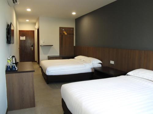 Cama o camas de una habitación en HOTEL SUKARAMAI