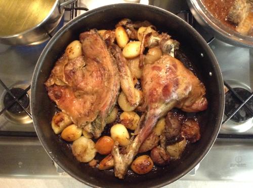 a pan filled with meat and potatoes on a stove at Casignano in Bagno a Ripoli