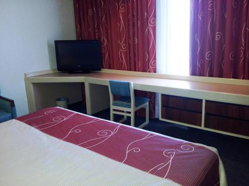 Postel nebo postele na pokoji v ubytování Hotel Fleming
