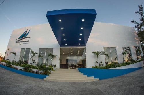 a building with a staircase in front of it at Hotel Santa Cruz Juchitan in Juchitán de Zaragoza