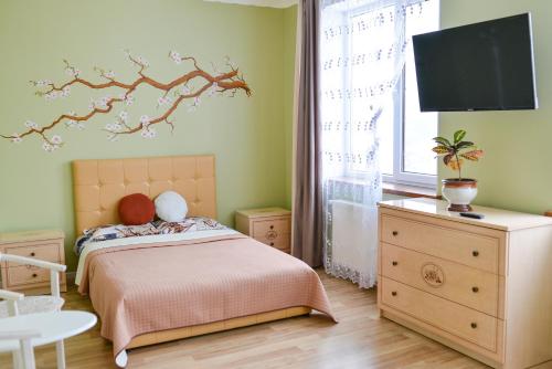 Кровать или кровати в номере Green Apartments Bandery 35