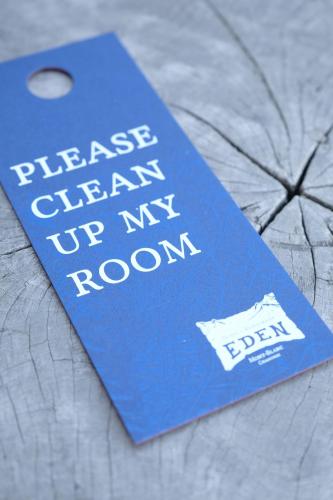 a blue book with the words please clean up my room at Eden Hotel, Apartments and Chalet Chamonix Les Praz in Chamonix-Mont-Blanc