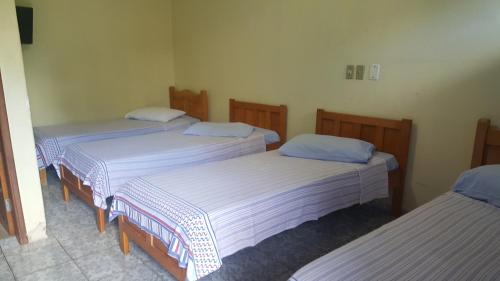 
Cama ou camas em um quarto em Hotel Blue Star II
