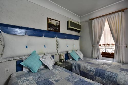 מיטה או מיטות בחדר ב-Safran Hotel