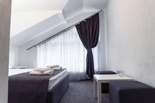 מיטה או מיטות בחדר ב-Geldberg