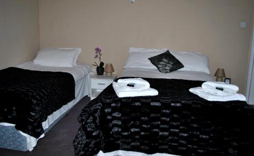 Katil atau katil-katil dalam bilik di Amber Guesthouse