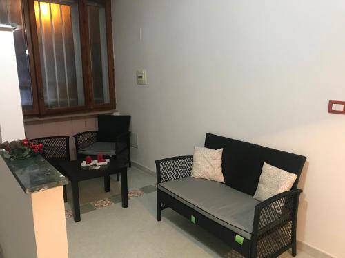 a living room with a couch and a table at Villa belvedere in Pontecagnano