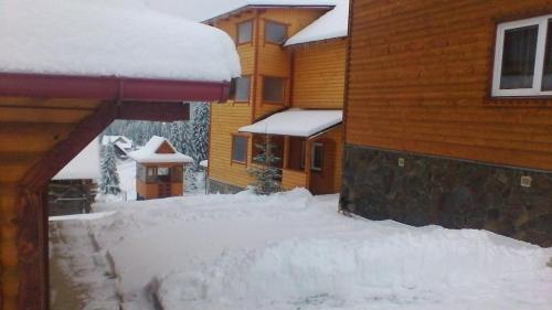 a pile of snow on the side of a house at Marichka in Yablunytsya