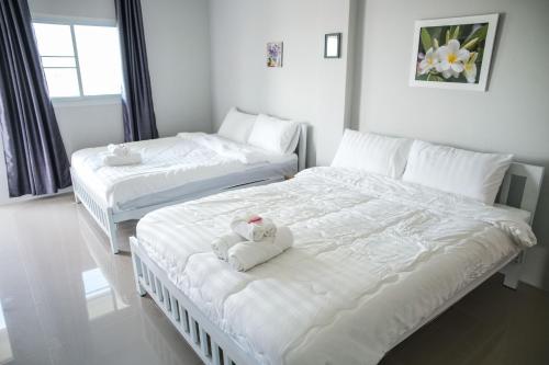 Postel nebo postele na pokoji v ubytování Lullaby Residence