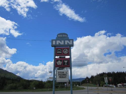 a sign for an entrance to a gas station at Wells Gray Inn in Clearwater