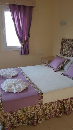 Una cama o camas en una habitación de Canna Garden Hotel - Adult Only