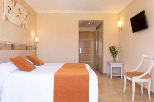 Ένα ή περισσότερα κρεβάτια σε δωμάτιο στο Hotel Plaza Cavana
