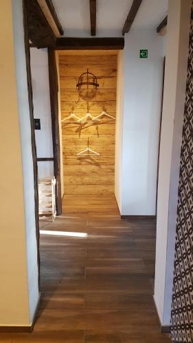 a hallway of a room with a wooden wall at Forester in Malmedy