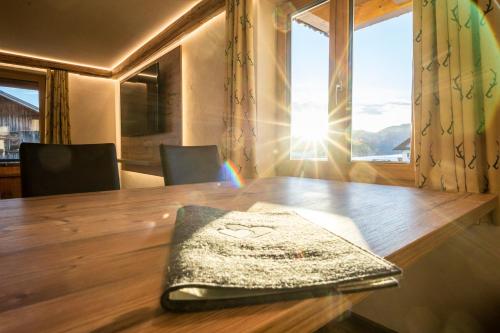a wooden table with a napkin on top of it at Haus am Rank in Oberstdorf