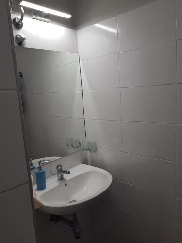 a bathroom with a sink and a mirror at Lux Apartment in Belgrade 2 in Belgrade