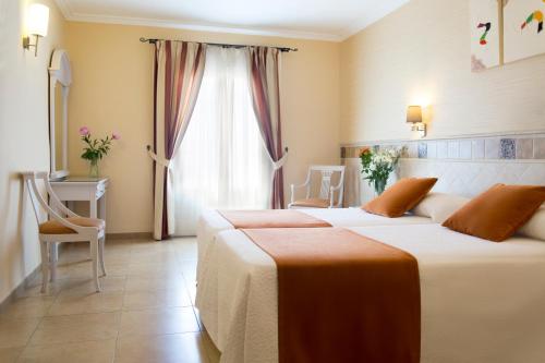 Ένα ή περισσότερα κρεβάτια σε δωμάτιο στο Hotel Plaza Cavana