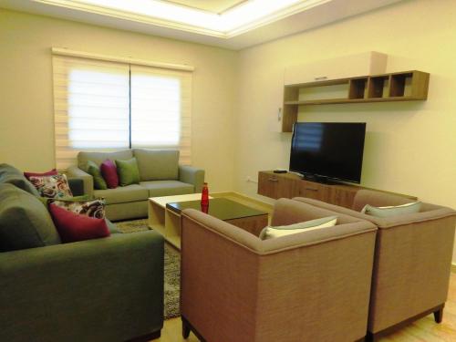 TV o dispositivi per l'intrattenimento presso Elite Residence - Koura , Near Tripoli