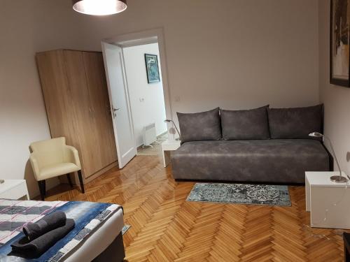 a living room with a couch and a bed at Lux Apartment in Belgrade 2 in Belgrade