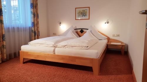Ένα ή περισσότερα κρεβάτια σε δωμάτιο στο Appartements Dornach