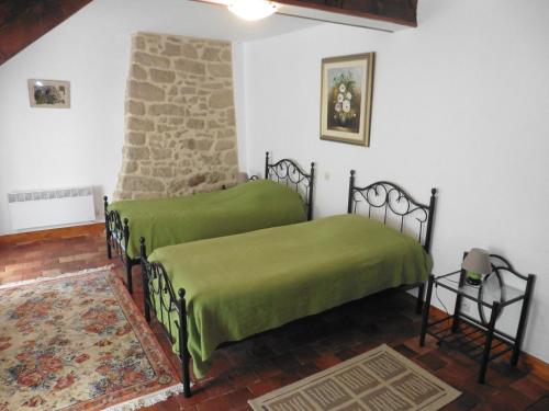 Postel nebo postele na pokoji v ubytování la maison de voueize