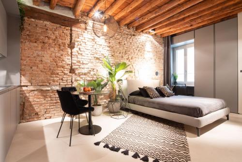 A seating area at OFFICINE CAVOUR Piazza Cavour