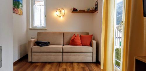 a couch with two pillows on it in a room at Ferienhaus Gundi in Pettneu am Arlberg